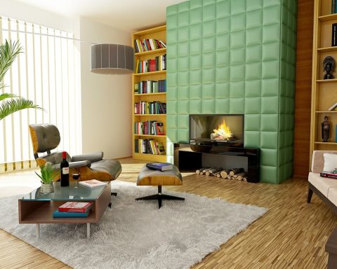 Elegant modern living room featuring stylish decor, bookshelves, and a cozy fireplace.