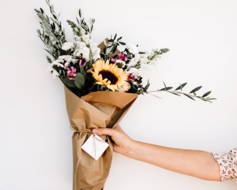 person holding bouquet of flowers