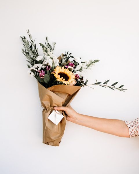 person holding bouquet of flowers
