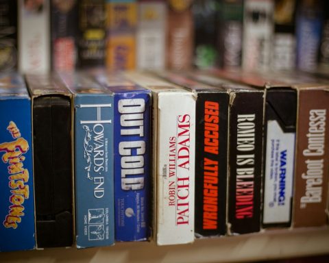 a row of books sitting on top of a shelf
