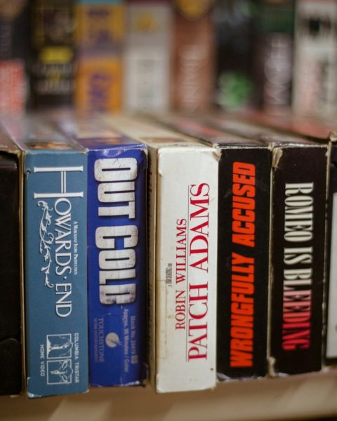 a row of books sitting on top of a shelf
