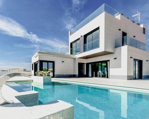white concrete building under blue sky during daytime