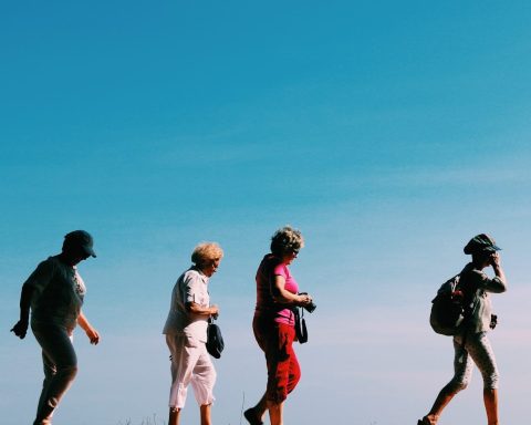 four people walking