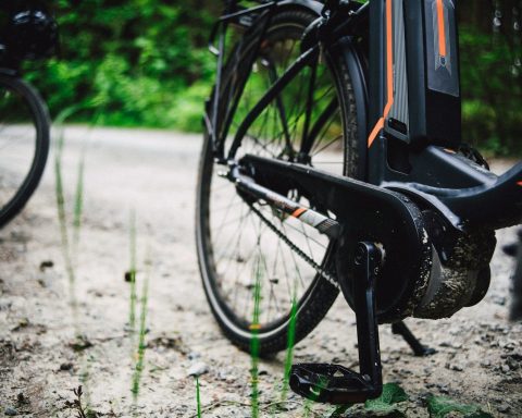 a close up of a bike on a dirt road